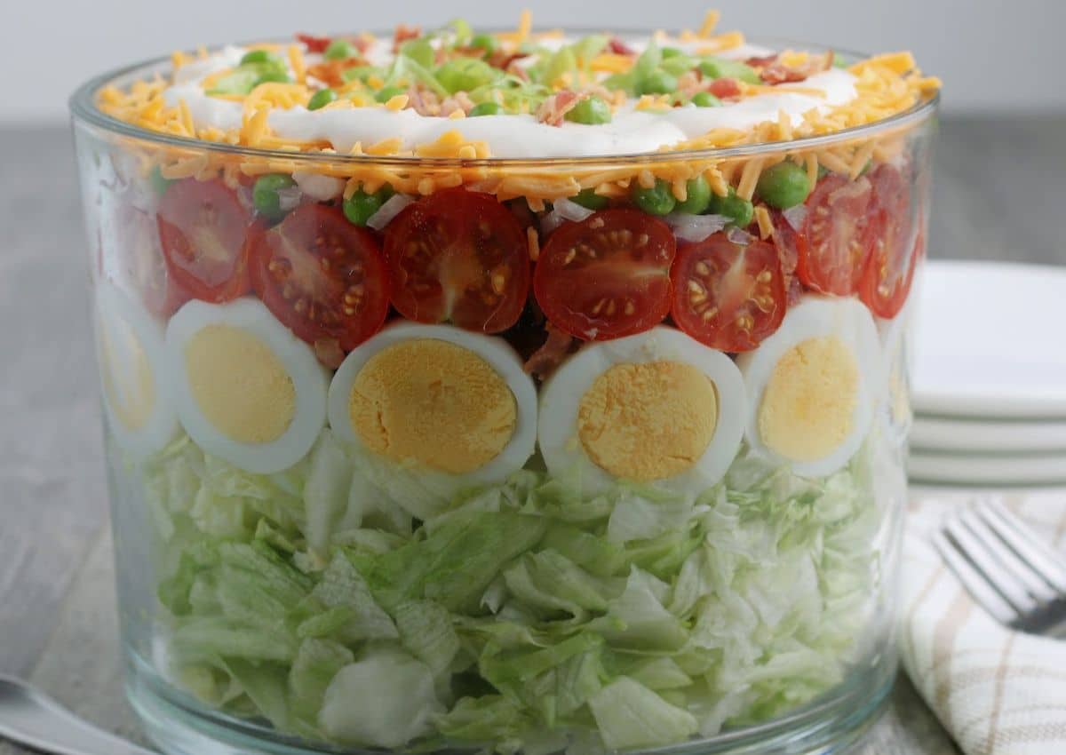 A salad in a glass container.