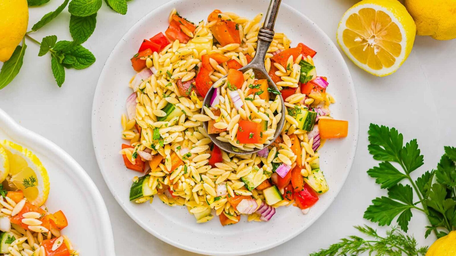 A plate of food with a spoon.