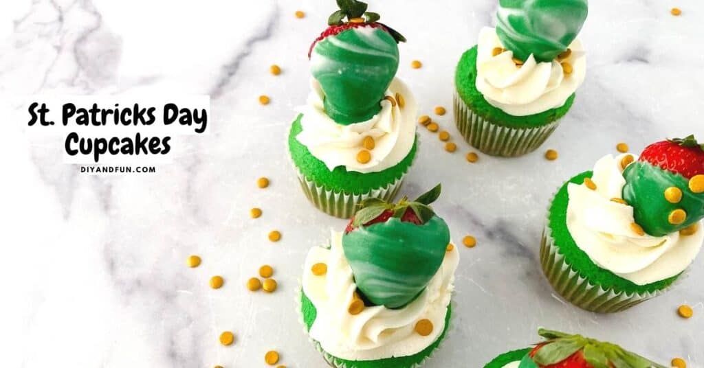 Green and white St. Patricks Day cupcakes topped with white frosting, chocolate-covered strawberries, and gold sprinkles on a marble surface.