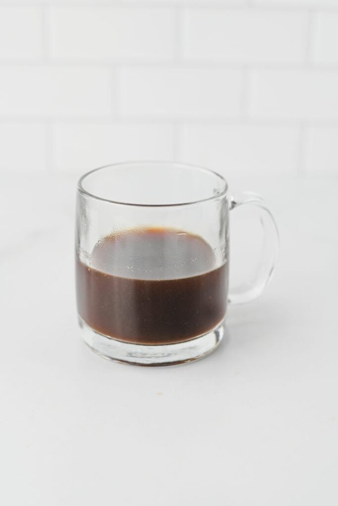 Chai tea concentrate poured into a glass mug
